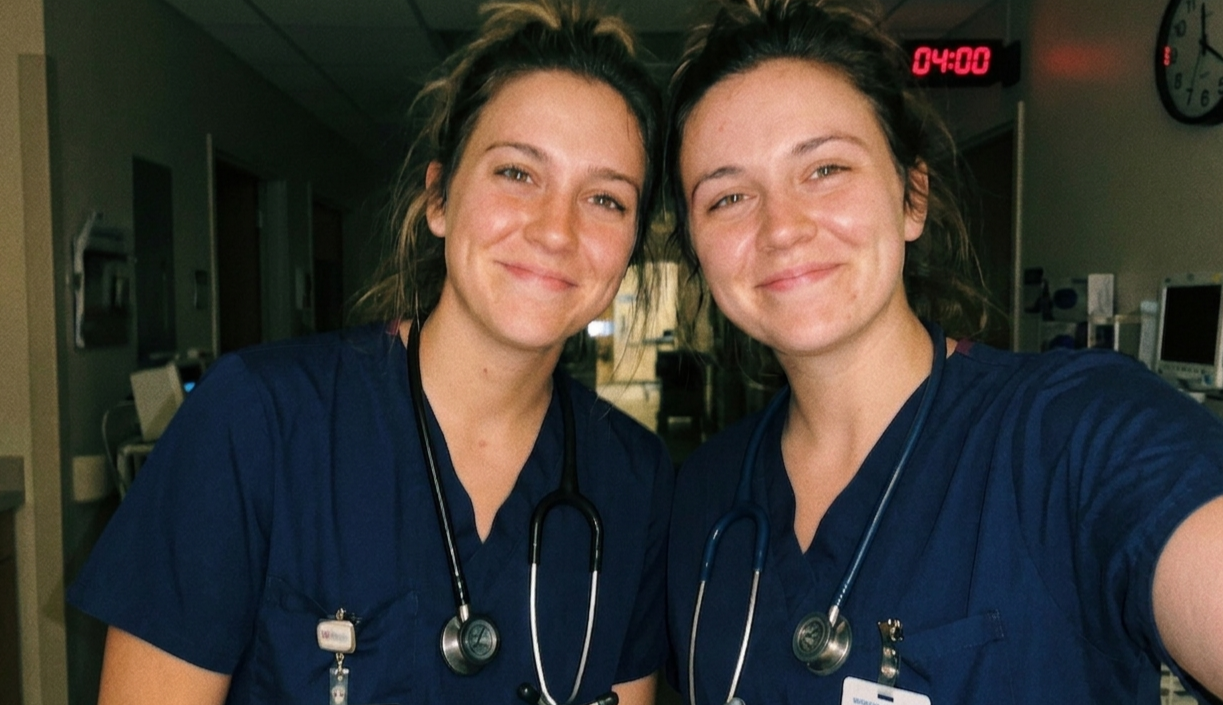 Two nurses smiling at the end of a 4am shift